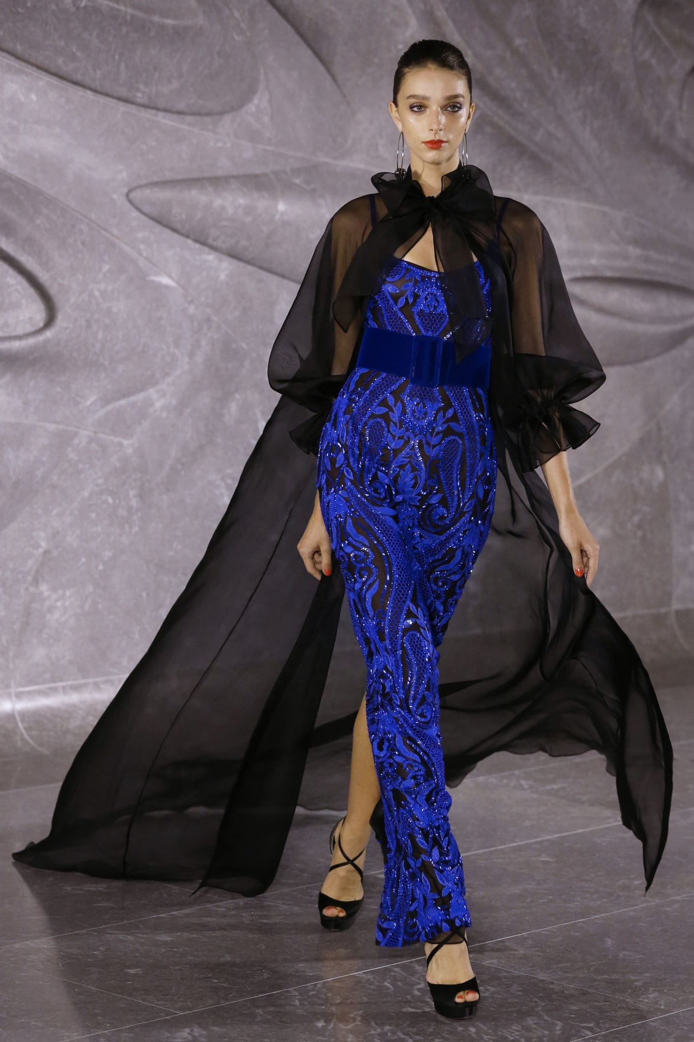 Naeem Khan sleeveless cobalt embroidered gown with belt and organza cape. (Photo by Dan Lecca)