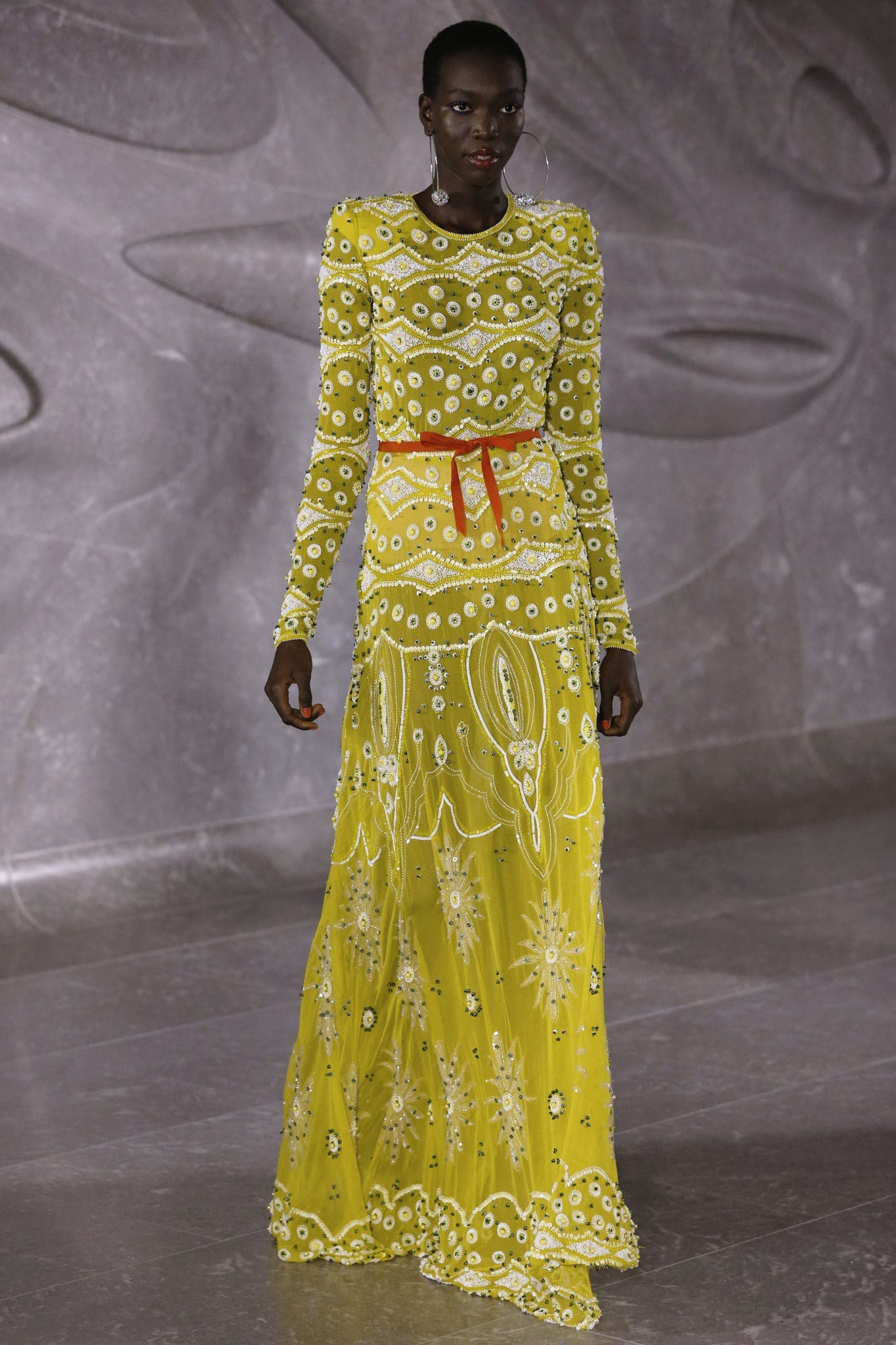 Naeem Khan long sleeve embroidered chartreuse gown with belt and shoulder pad details. (Photo by Dan Lecca)