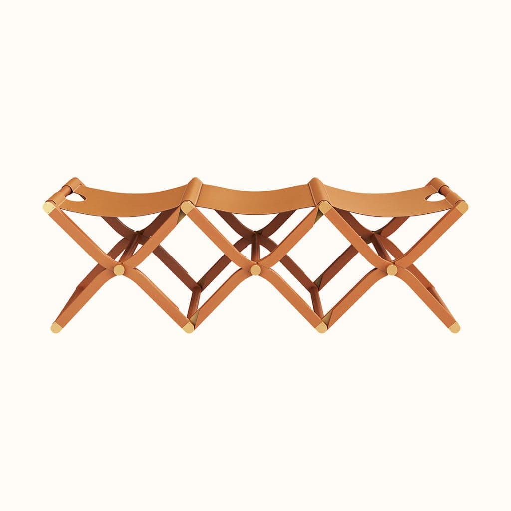 Every piece of furniture, from this three-seater bench to an oxblood daybed, is glamorous. 