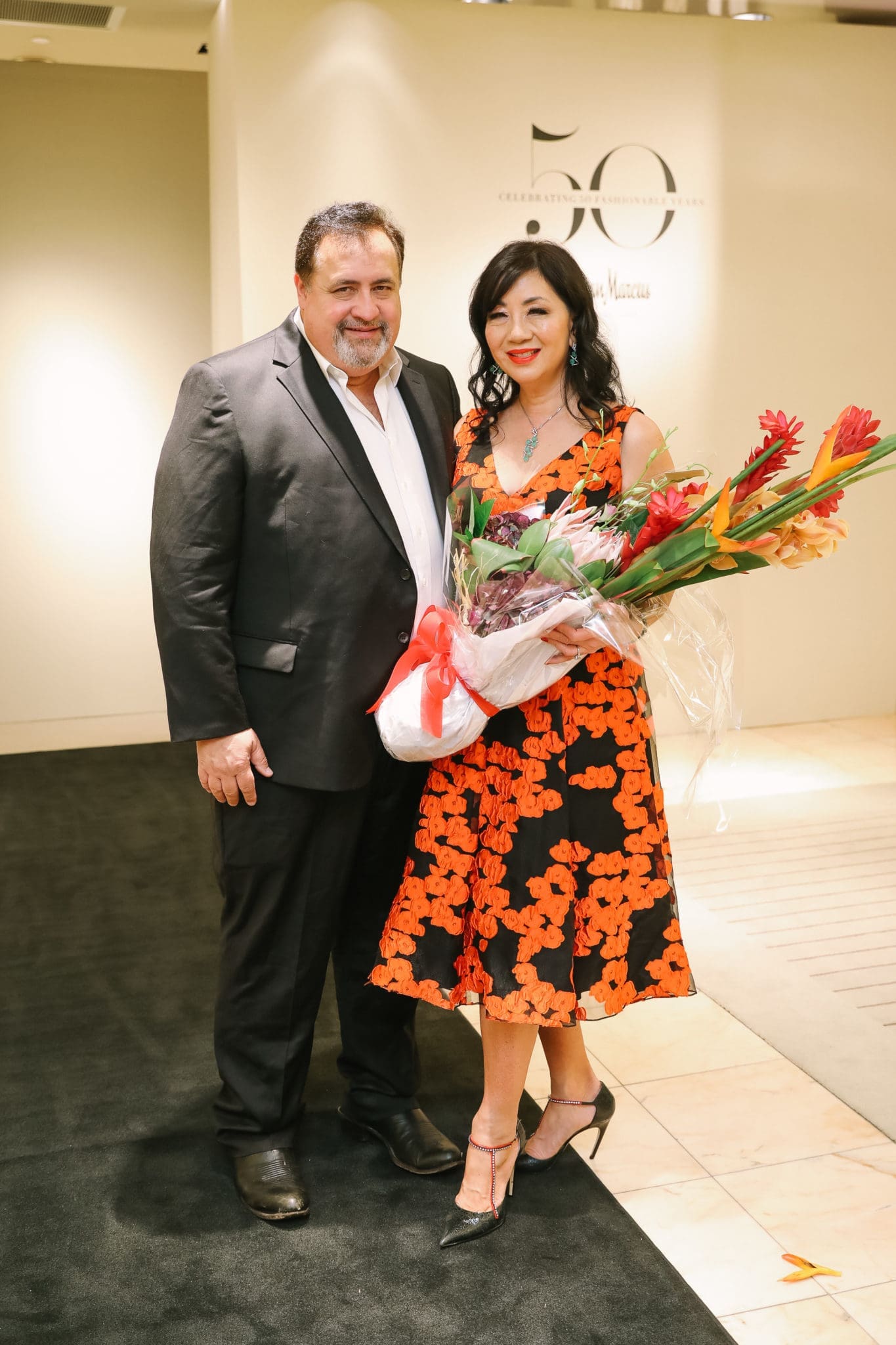 Matthew Brams & Alice Mao Brams, who chose her Lela Rose dress because of the Astros orange. (Photo by Johnny Than)