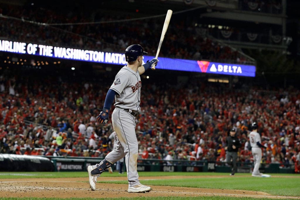 Alex Bregman extended his bat in one hand and posed for a moment — or three — after upending the World Series with a grand slam.