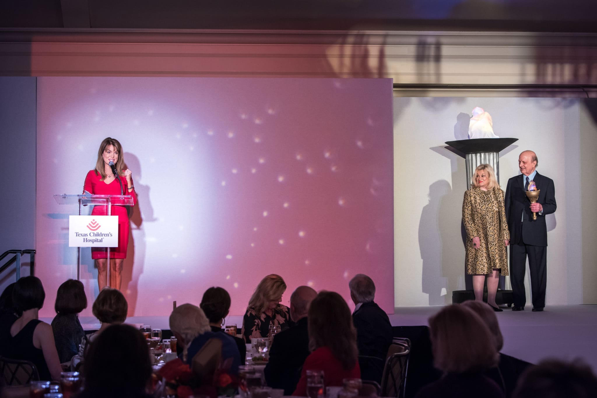 Emcee Melissa Wilson, honorary event chairs Sydney & Don Faust (Photo by Allen S. Kramer/Texas Children’s Hospital)