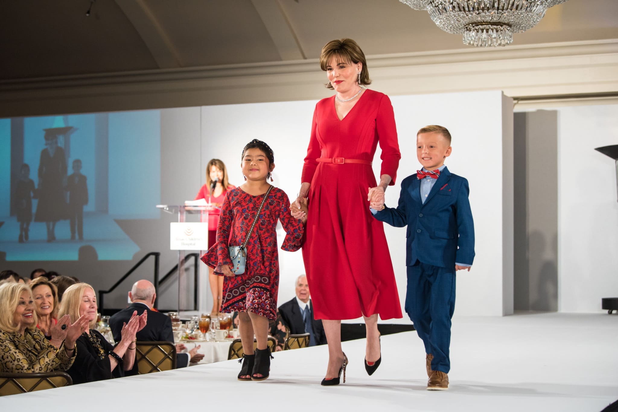  Hallie Vanderhider escorts cancer patients Makayla Acabal and Colt Wilson at the Celebration of Champions luncheon. (Photo by Allen S. Kramer/Texas Children’s Hospital)
