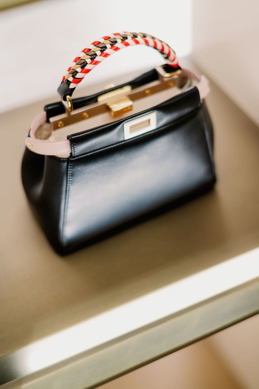 Peekaboo Iconic Mini black leather bag reveals Fendi's way with witty details. (Photo by Joseph West)