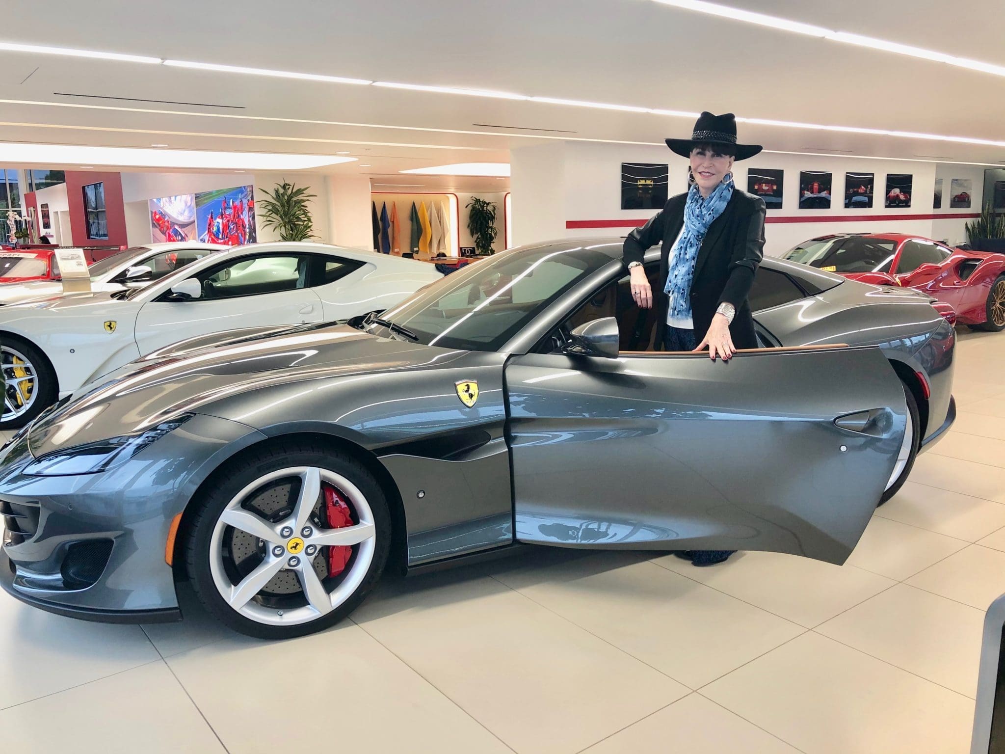 Before lowering the hard top on the Ferrari Portofino, one might consider donning a hat for the high-speed turbulence. (Courtesy photo)