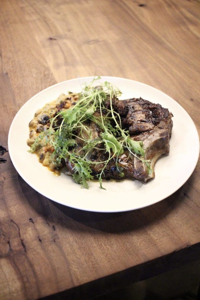 Lockwood Distilling Co.'s new menu will include a pork chop from chef Justin Box. (Photo by Susie Oszustowicz)