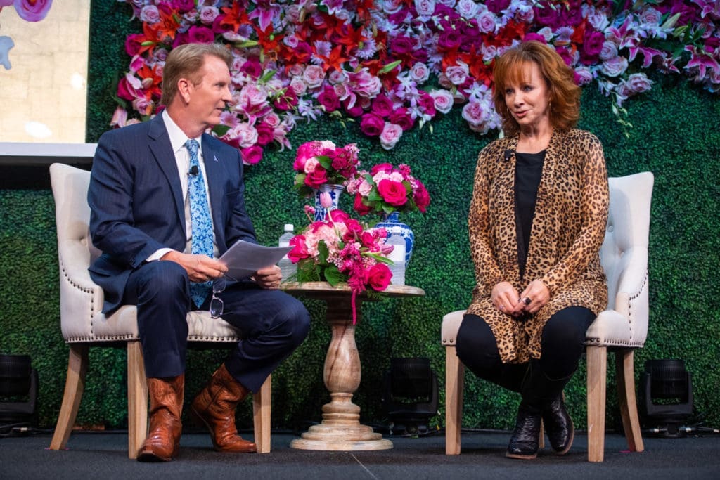 Frank Billingsley and Reba McEntire discuss all things important and fun at the annual Razzle Dazzle luncheon.(Photo by Michelle Watson)