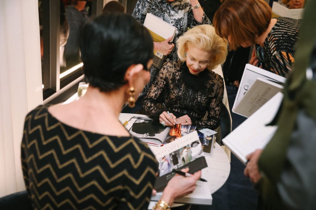 International Best Dressed List Hall of Famers Lynn Wyatt and Amy Fine Collins sign copies of 'The International Best Dressed List."  (Photo by Johnny Than)