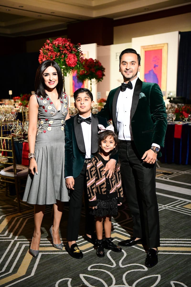 Una Notte in Italia co-chair Sneha Merchant with her children, Zaryan and Zenya, her husband Nick Merchant. (Photo by Daniel Ortiz)