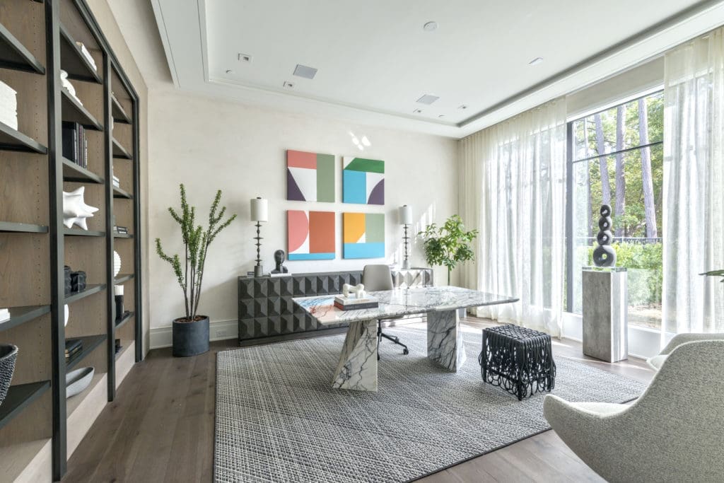 The size of this home office dictated a spectacular work space, here provided by a Cantoni dining table. (Photo by Jeff Myers Photography)