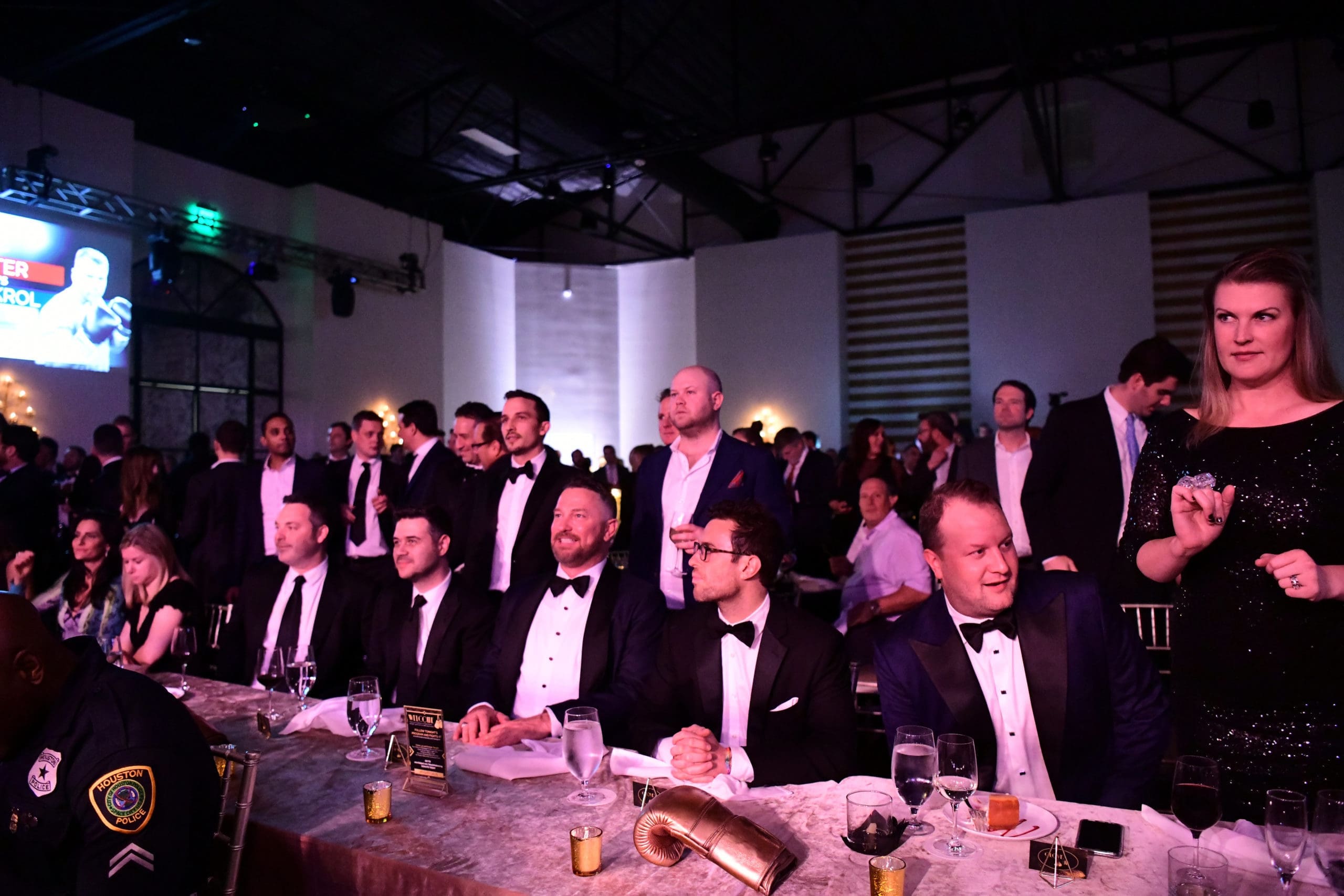 The black-tie crowd places their bets and cheers on the contenders at Black Tie Boxing. (Photo by Daniel Ortiz)