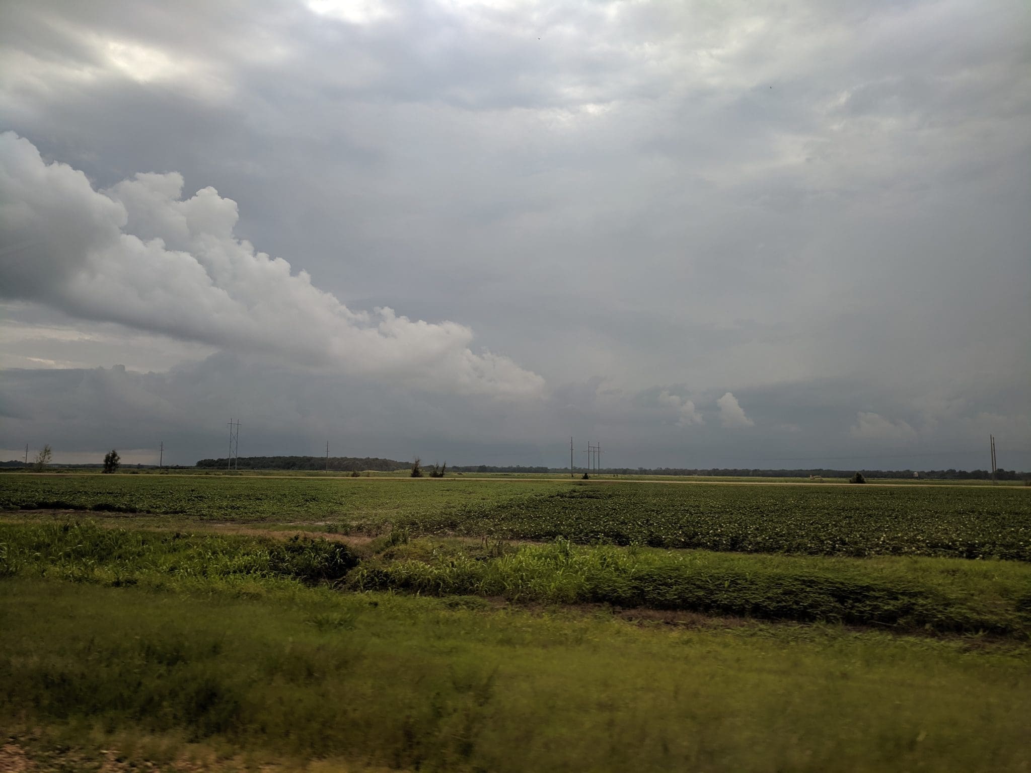 Connecting with land and sky on the way to Clarksdale, Mississippi. (Photo by Ariane Roesch and Zak Miano)