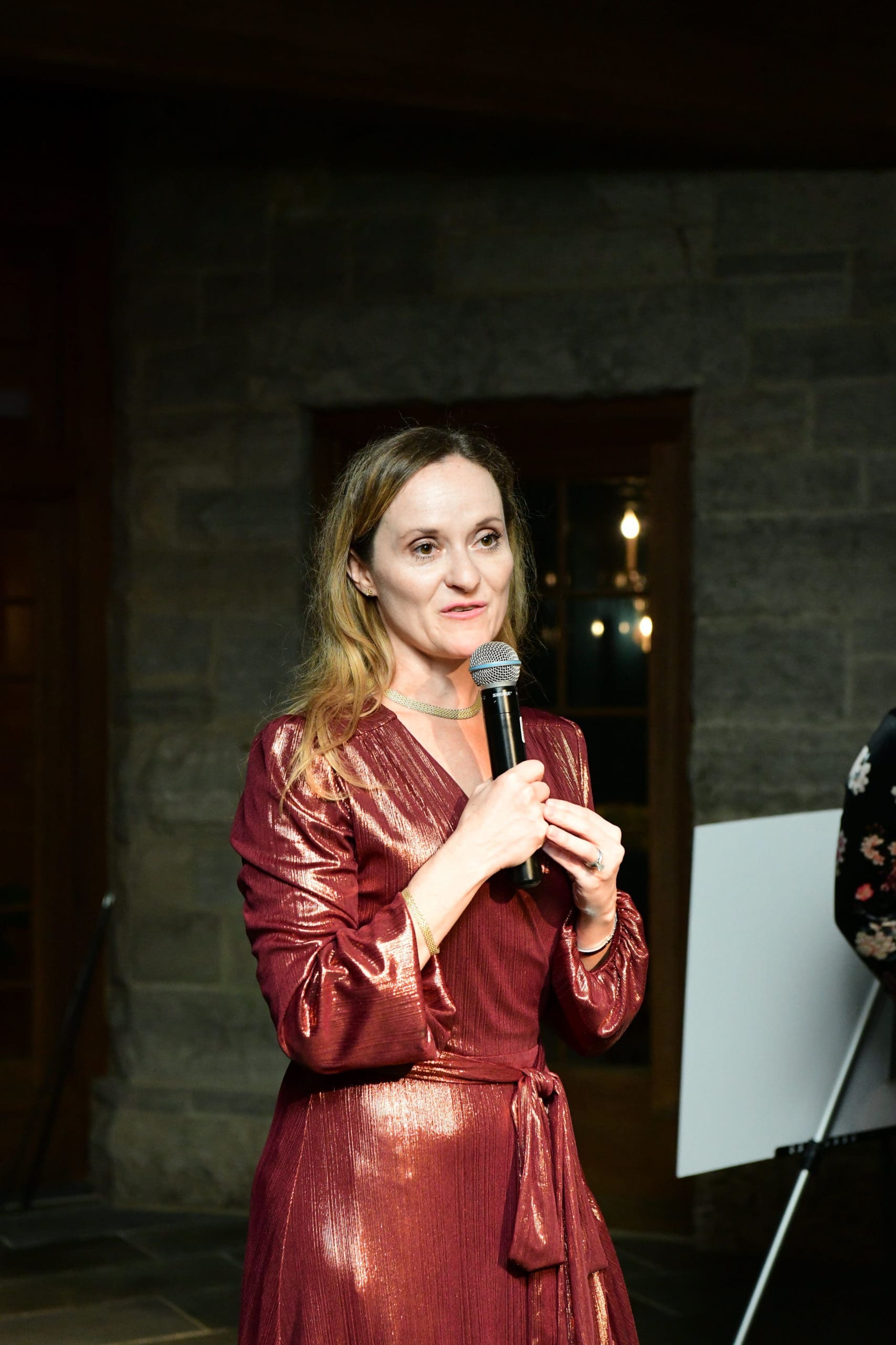The Galleria's Lisa Bendfeldt reveals the raffle winners. (Photo by Daniel Ortiz)