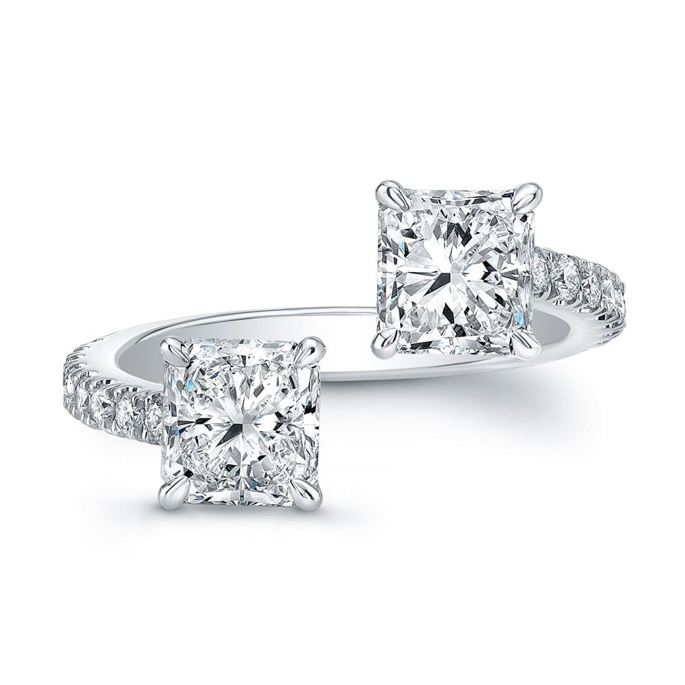 Norman Silverman 18K white gold diamond bypass ring with radiant cut diamonds, $21,000.
