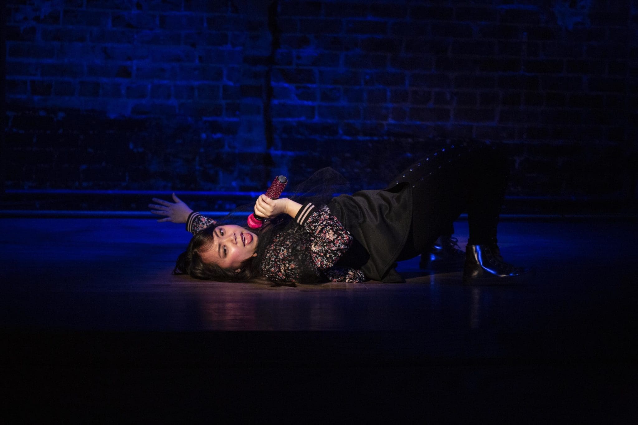 Lilith (Mai Le)sings a solo.  (Photo by Claire Logue)