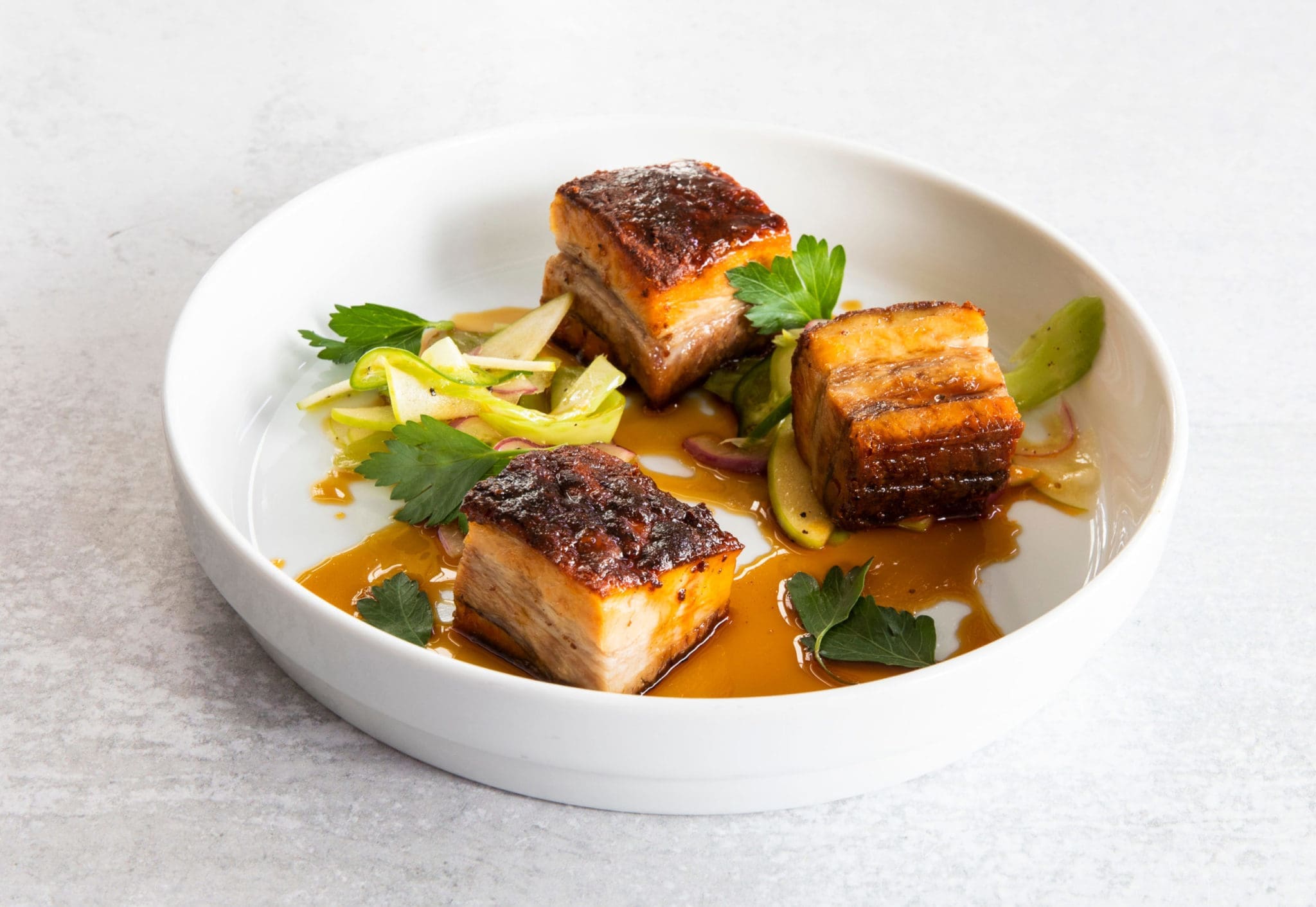 Slow-roasted pork belly with Steen's cane syrup (Photo by Julie Soefer)