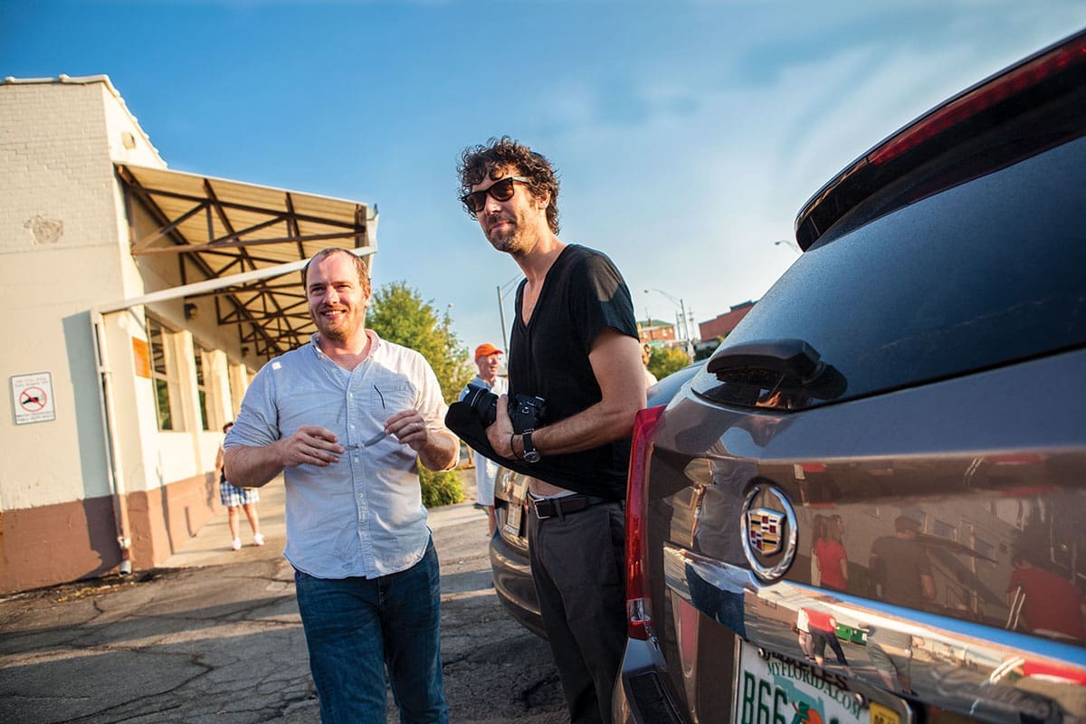 Hesse McGraw with artist Michael Jones McKean, 2012, Omaha, Nebraska. McGraw is known as an artist’s advocate who has devoted more than a decade of his career to realizing innovative curatorial projects beyond museum walls. (Photo courtesy Omaha Magazine)