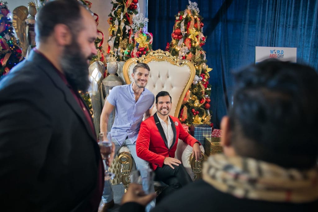 AIDS Foundation Houston World AIDS Day luncheon guests Coby Tumlinson, Anthony Ferrell  in a holiday mood. (Photo by Morris Malakoff) 