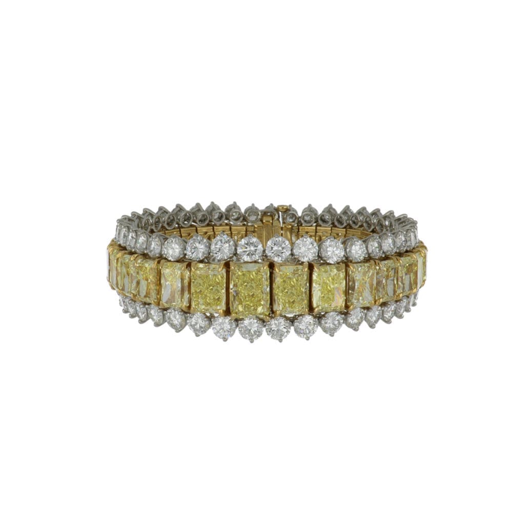 An important modern estate 18K yellow gold and platinum radiant-cut yellow diamond bracelet with round brilliant-cut diamonds.Circa 2000.