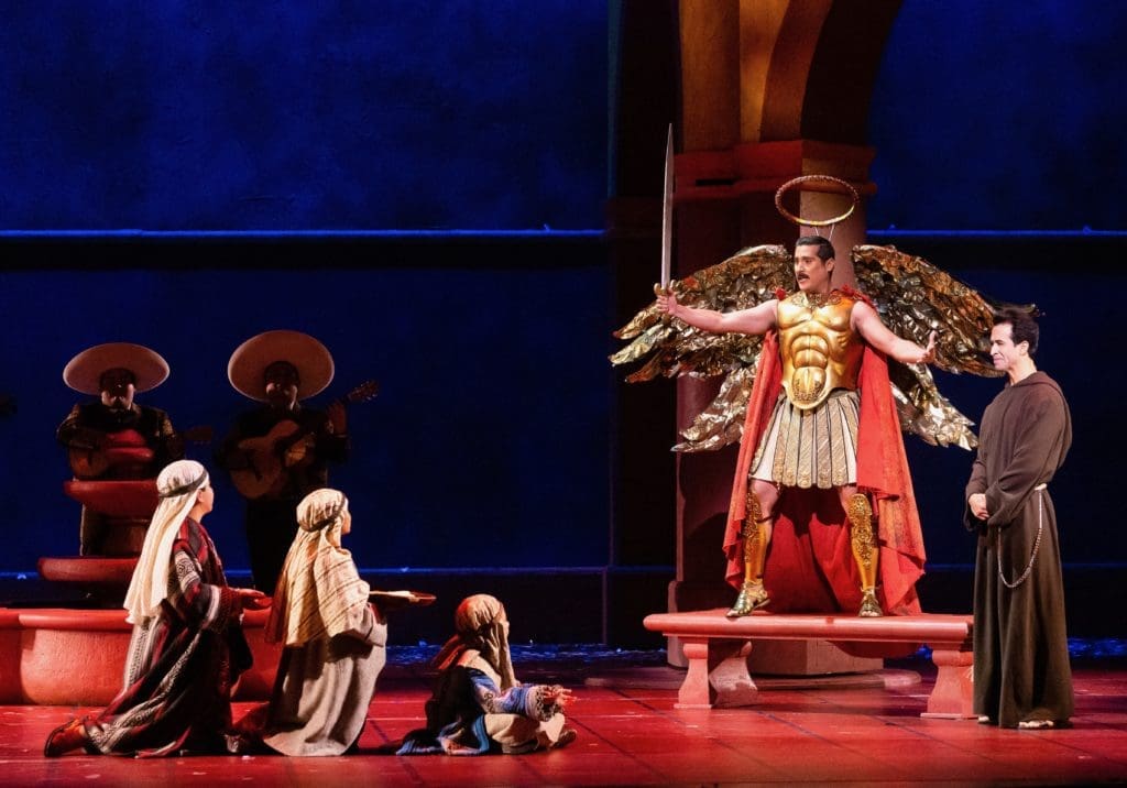 Children, Miguel de Aranda as Chucho, and Rafael Moras as Father Matia. (Photo by Lynn Lane)