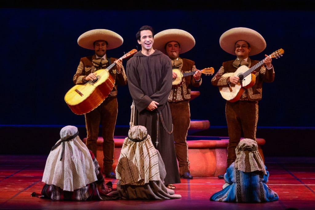 Rafael Moras as Father Matias sings to the children at the pastorela rehearsal. 
 (Photo by Lynn Lane)
