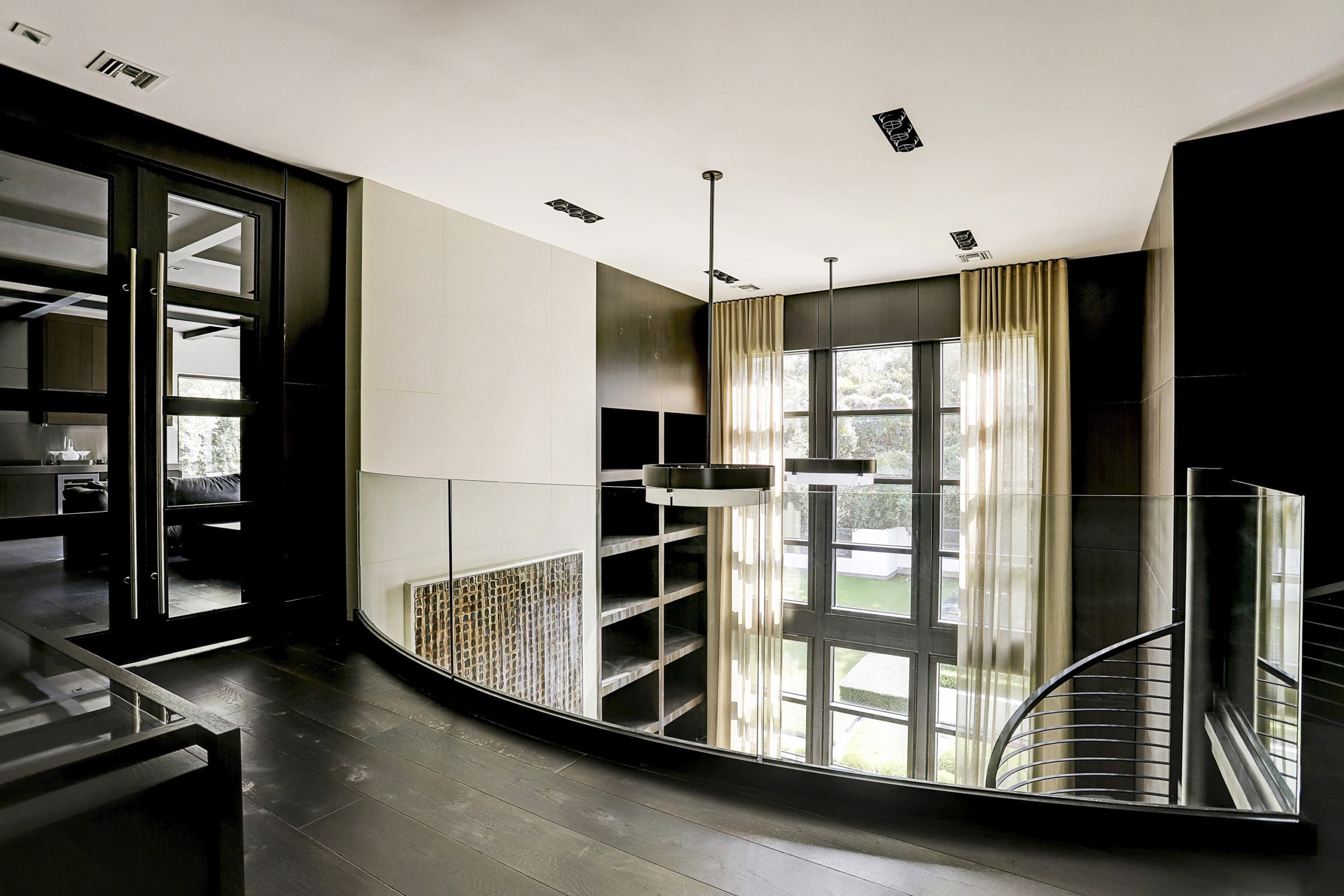 French doors lead to the cigar room from the balcony overlooking the office. (Photo by TK Images)