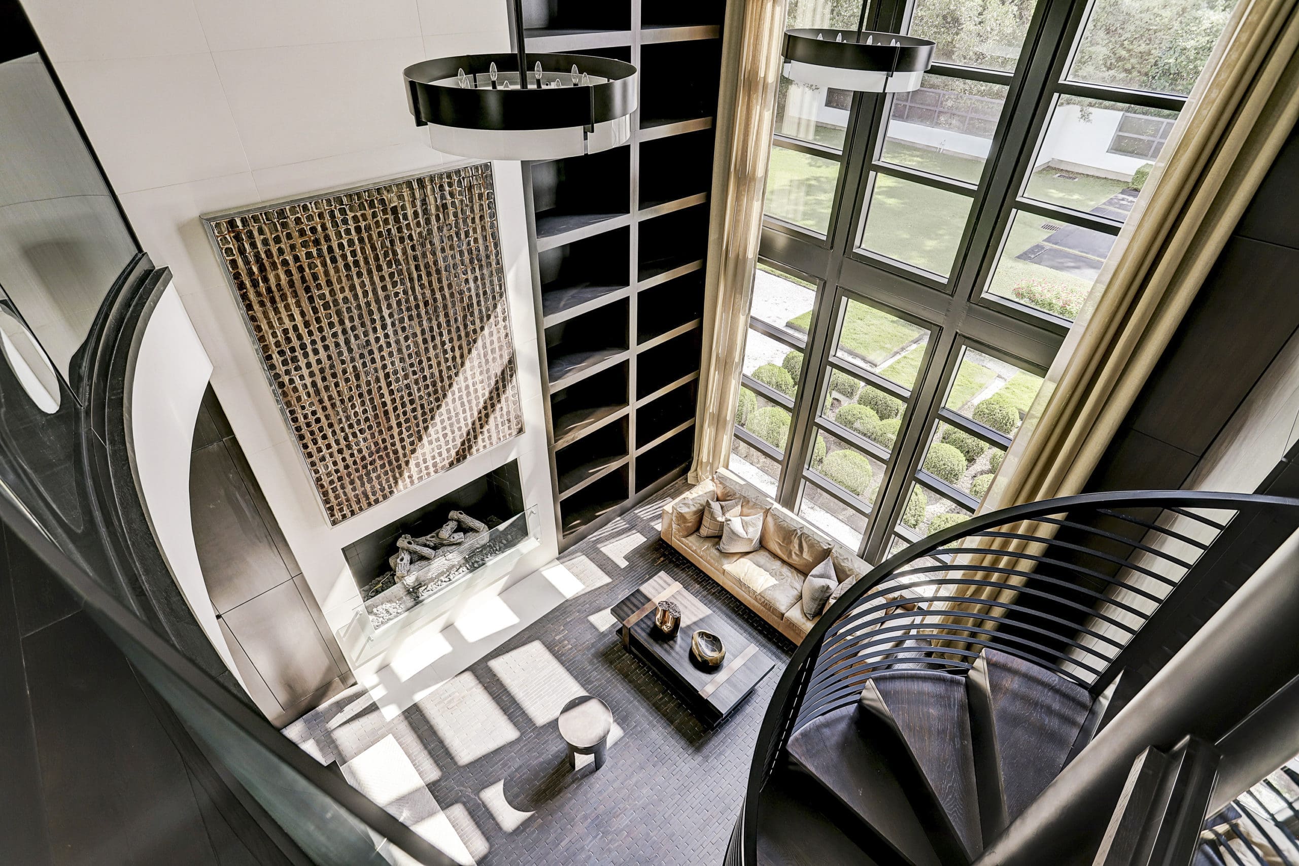 The two-story office has a circular stair leading to the cigar room. (Photo by TK Images)