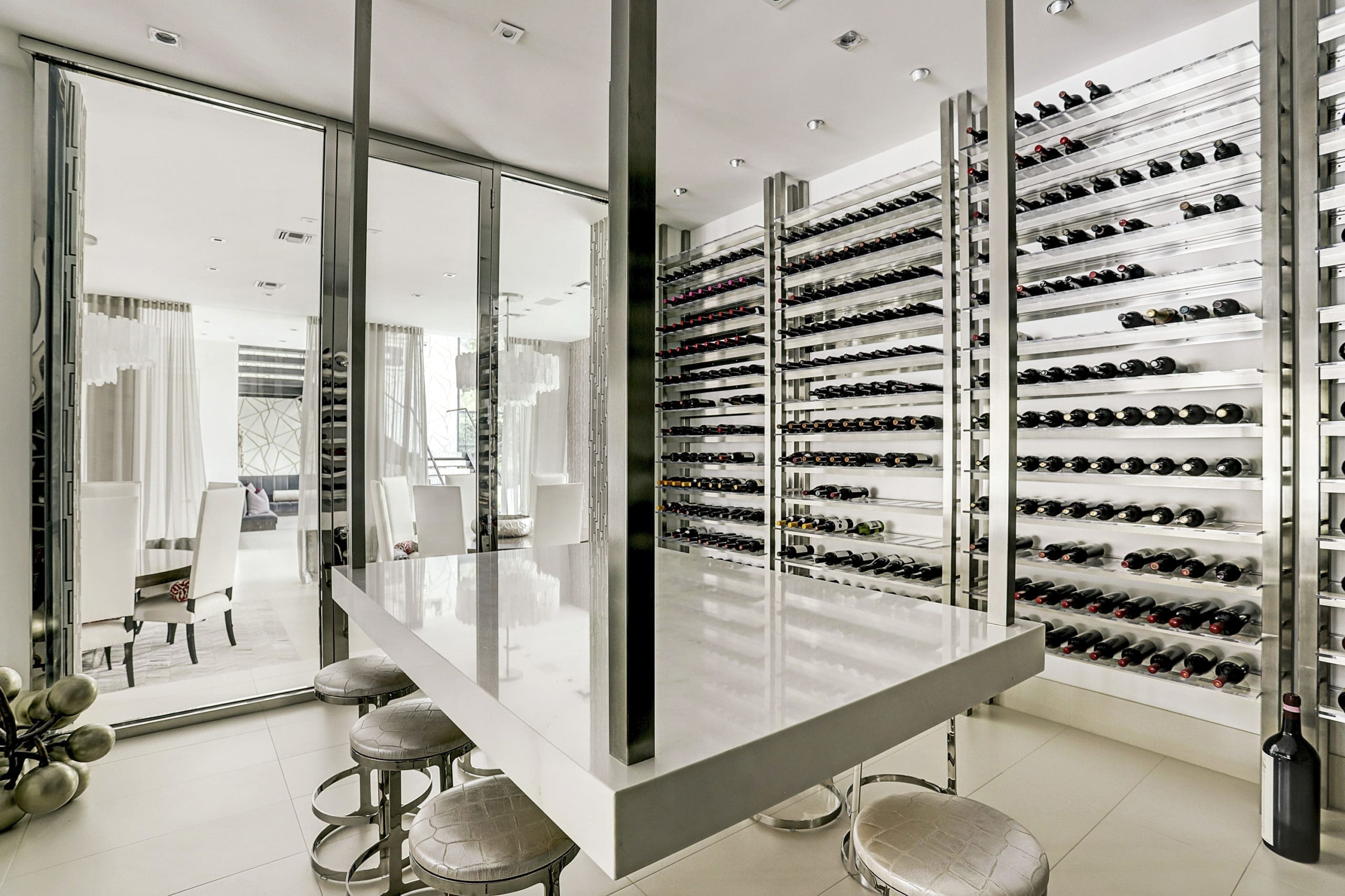 The acrylic-encased wine room offers views to the dining room on one side and the bar on the other (Photo by TK Images)