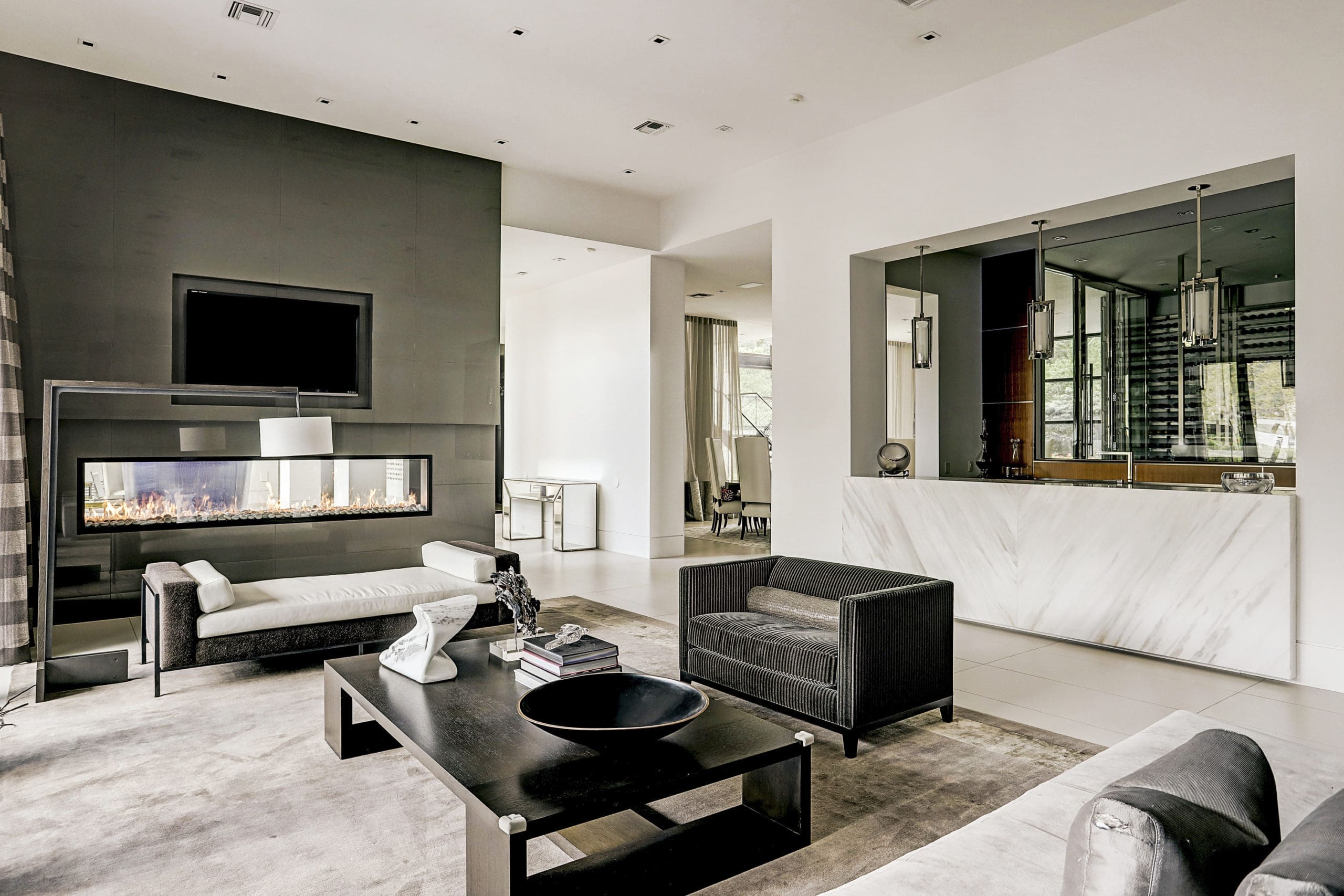 The family room which features a 10’ long linear, double-sided Montigo fireplace. 
 (Photo by TK Images)