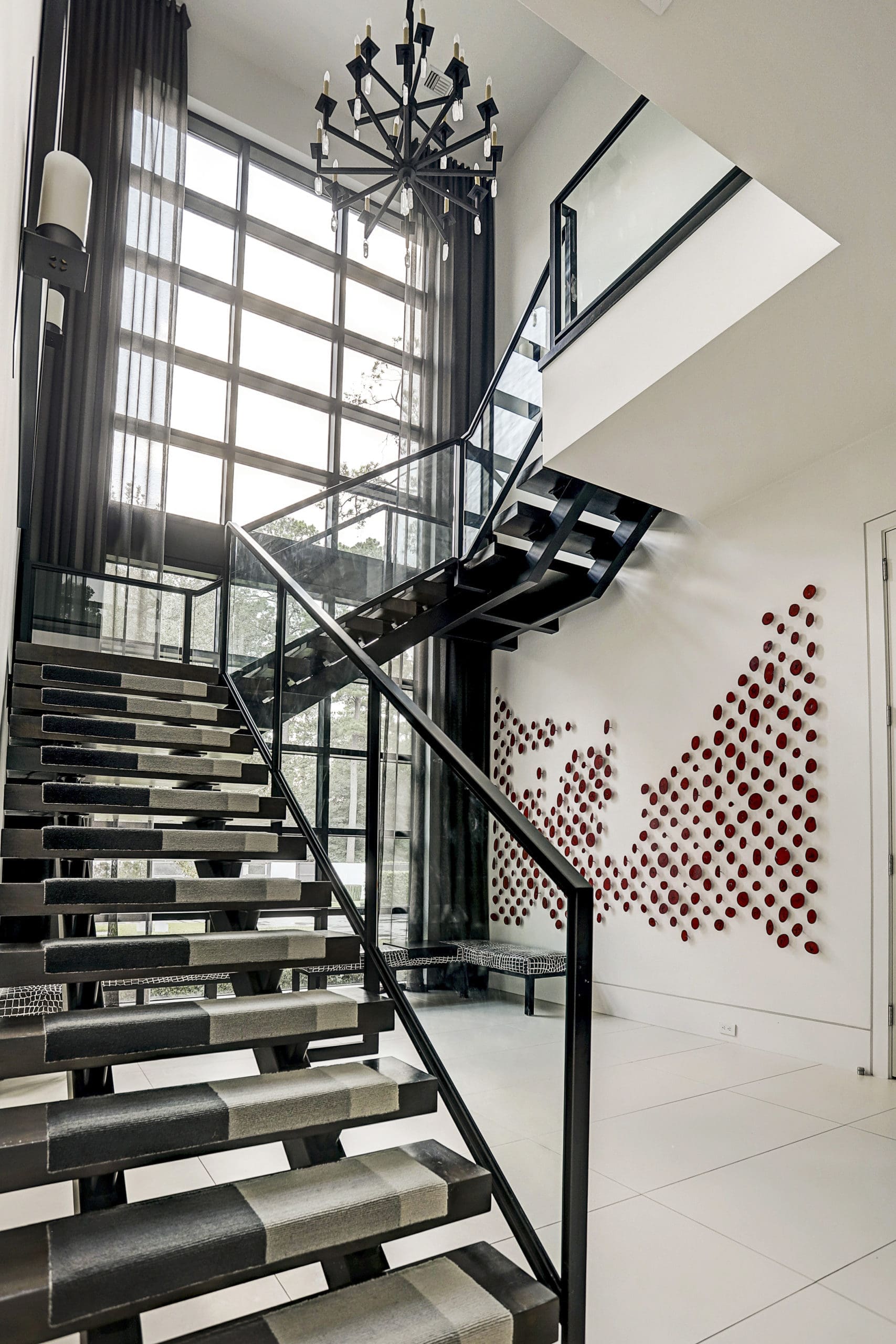 One of two glass and steel staircases in the Sandringham home. (Photo by TK Images)