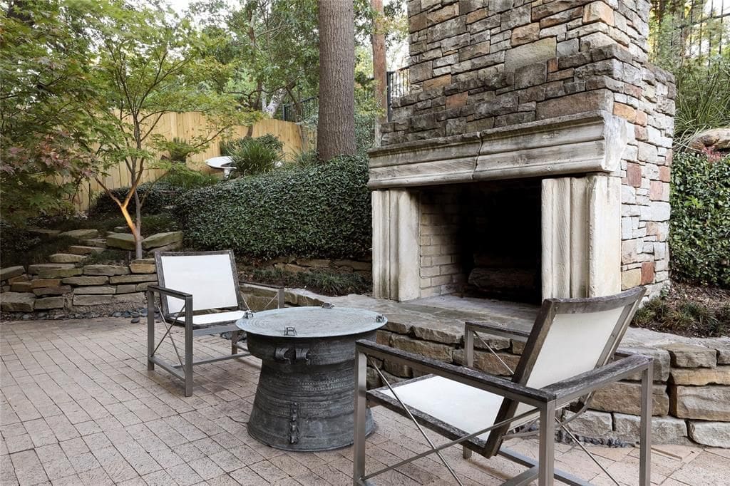 A private fireplace in the backyard of 3832 Turtle Creek Drive. (Photo by Compass Real Estate )