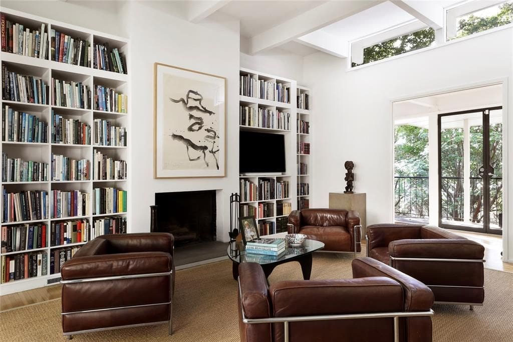 Enviable, towering built-ins in this Turtle Creek Drive home. (Photo by Compass Real Estate )