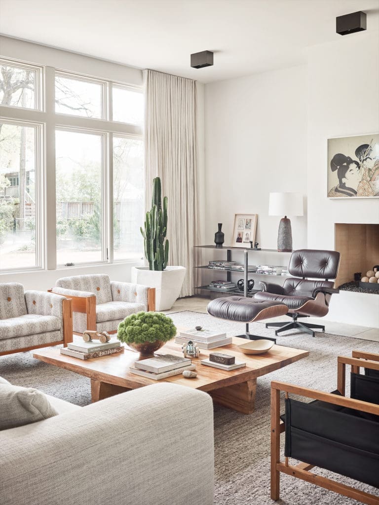 Chad Dorsey fell in love with the rugged wood-slab coffee table 15 years ago at a sample sale. Samsung Frame art TV over the fireplace. (Photo by Stephen Karlisch)
