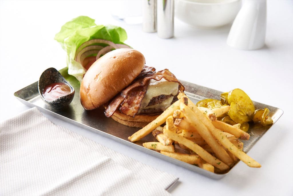 Ellie's Burger is made with Texas CBS Blend and smoked thick cut bacon, all served on brioche bun. 