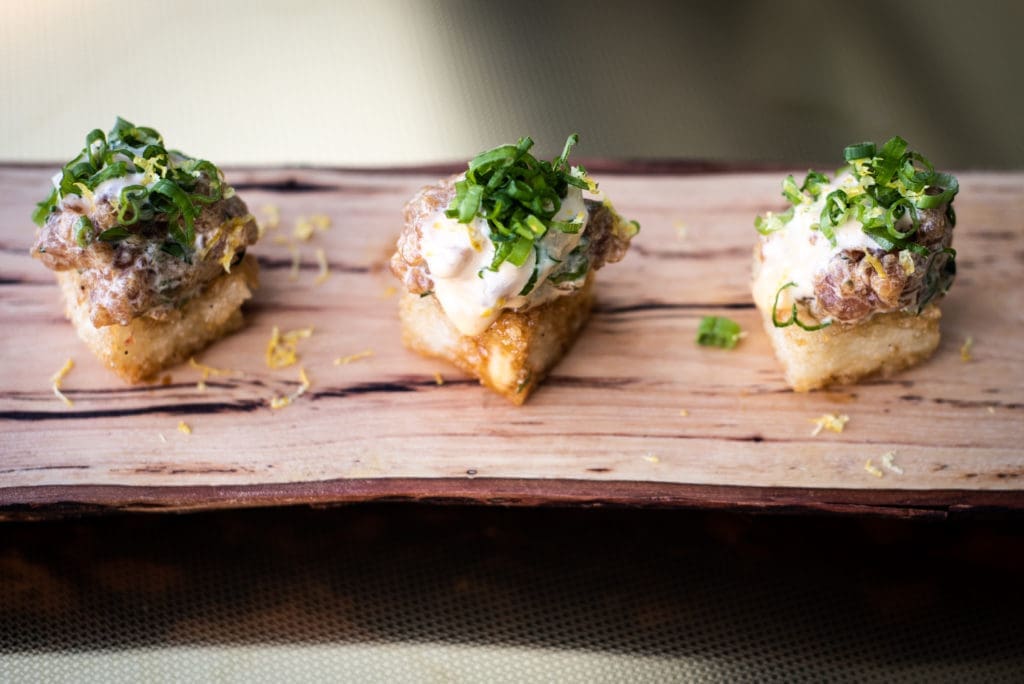 Tuna tartare comes with crispy rice and miso dressing. Courtesy of Foxyco