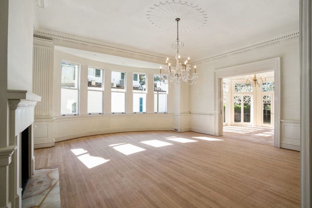 The home features original millwork, grand staircases and sunny spaces, 