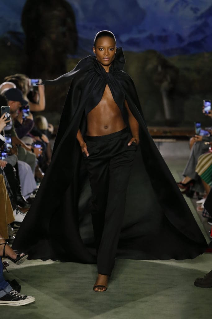 The cheering started as soon as the first model, clad in black satin slacks and a cape fastened at the neck exposing her midriff, came out. (Photo by Monica Feudi)