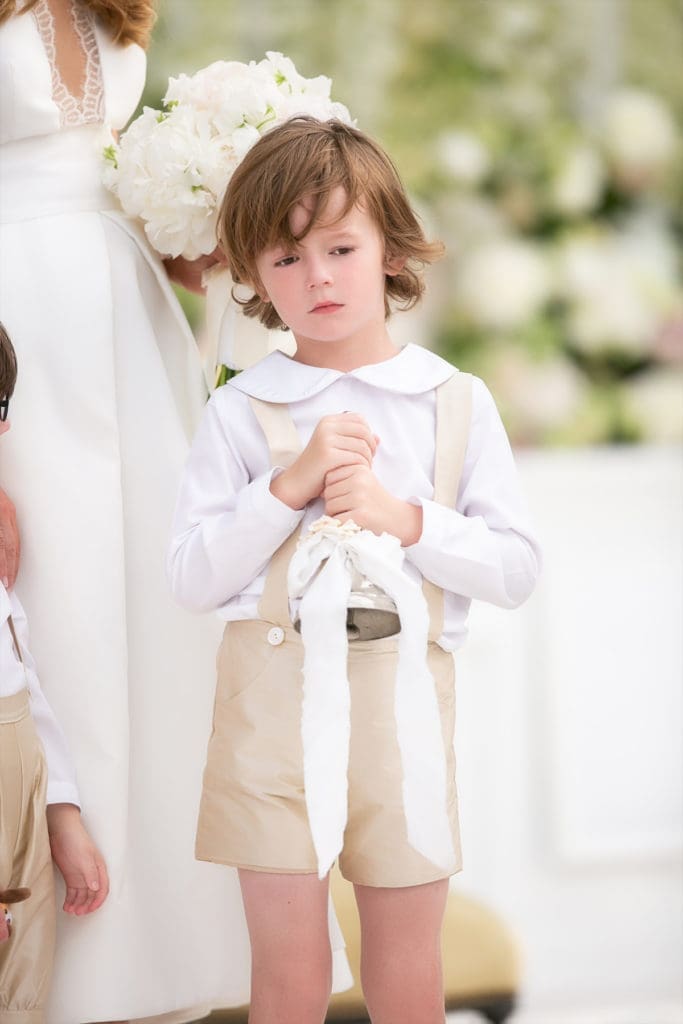 As ring bearer, Kari’s son Tobin carried an antique silver bell — the same one his cousin JR had carried in Kari’s wedding. (Photo by John Cain)