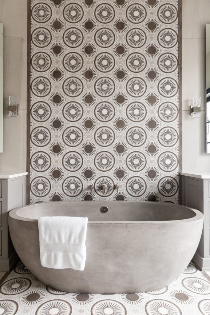 The solid concrete tub in the master bath is a unique touch from NativeTrails. The mixed geometric mosiac adds interest to the setting. (Photo by Jen Burner)