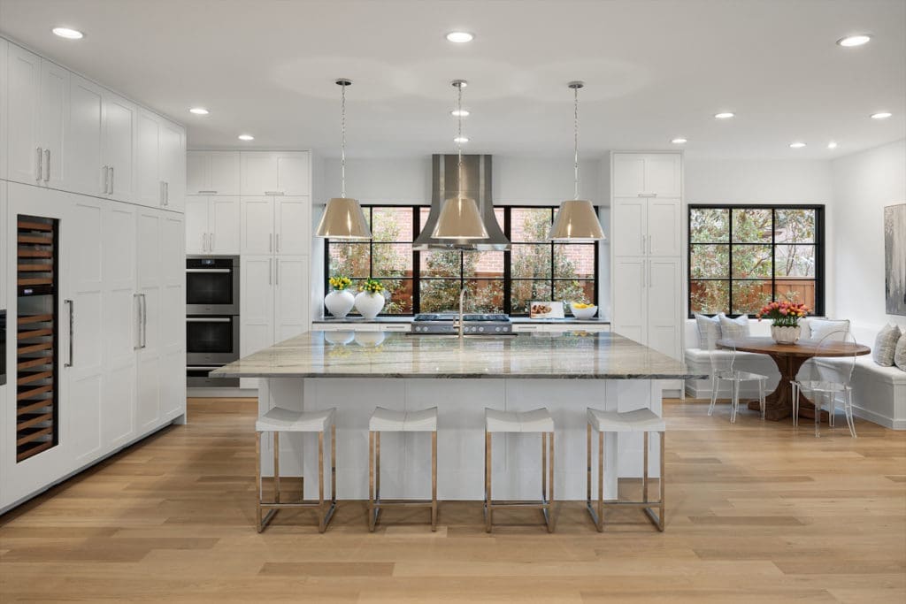 A built-in banquette offers a cozy seating area in the spacious kitchen. 