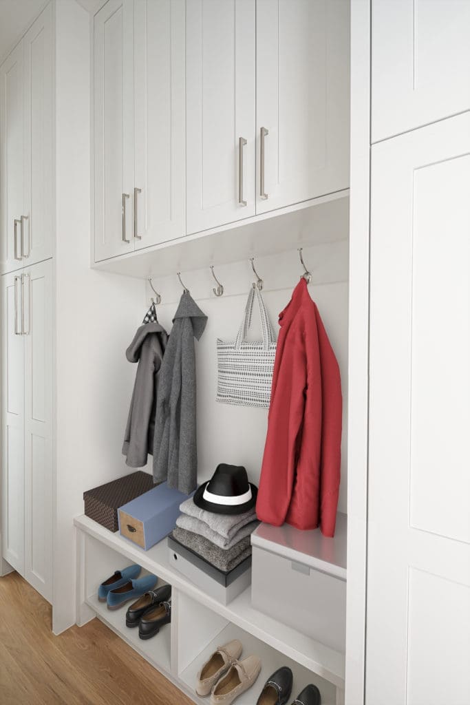 The mud room has enough well-placed hooks and cabinets to keep a family of any size organized.