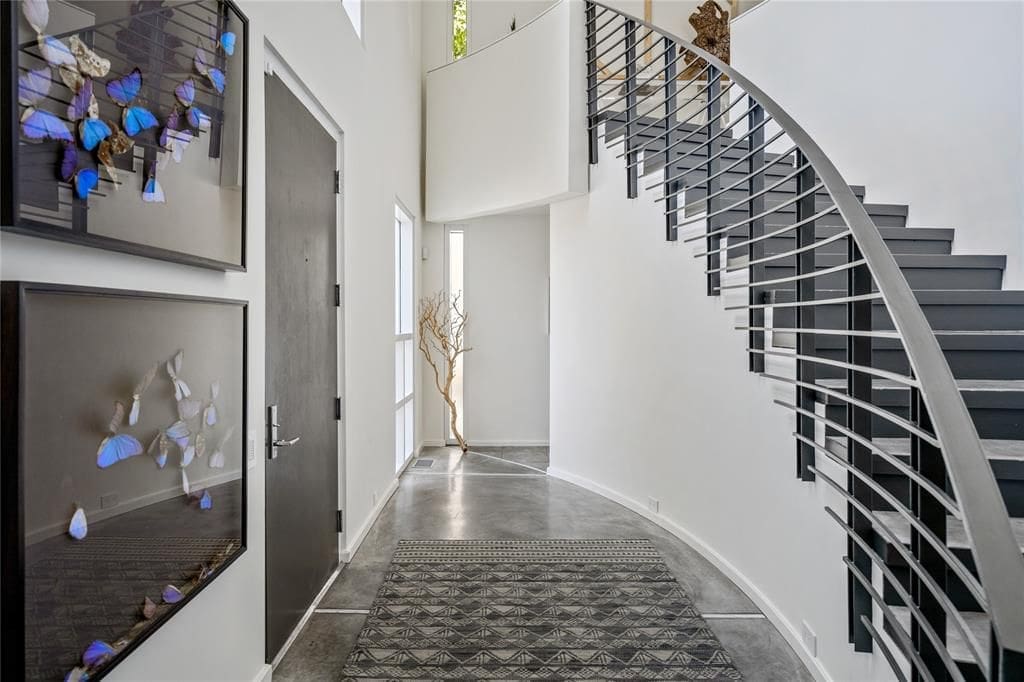 A streamlined stairwell. (Photo by Briggs Freeman Sotheby's)