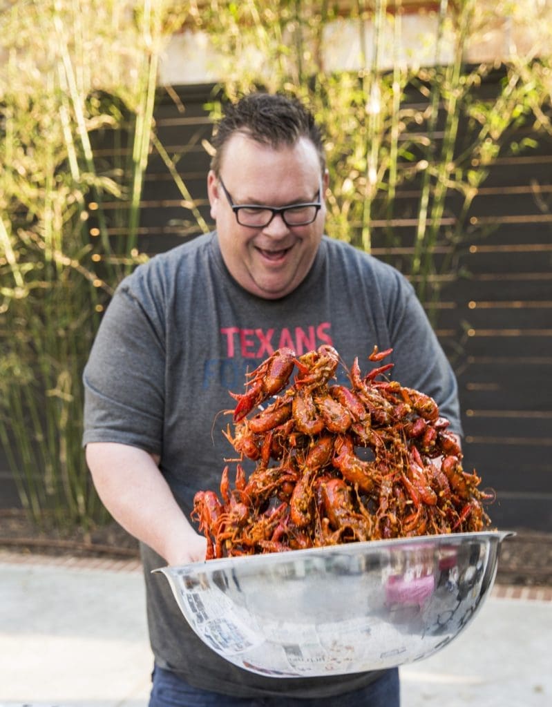 Chef Chris Shepherd displays his crawfish juggling talents at a backyard mudug fest. (Instagram photo)