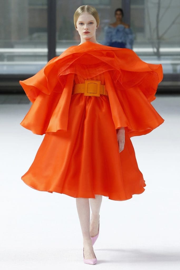 Carolina Herrera clementine orange satin face organza multi-tiered ruffle dress, clementine orange square buckle belt, pale pink pumps. (Photo courtesy of Carolina Herrera)