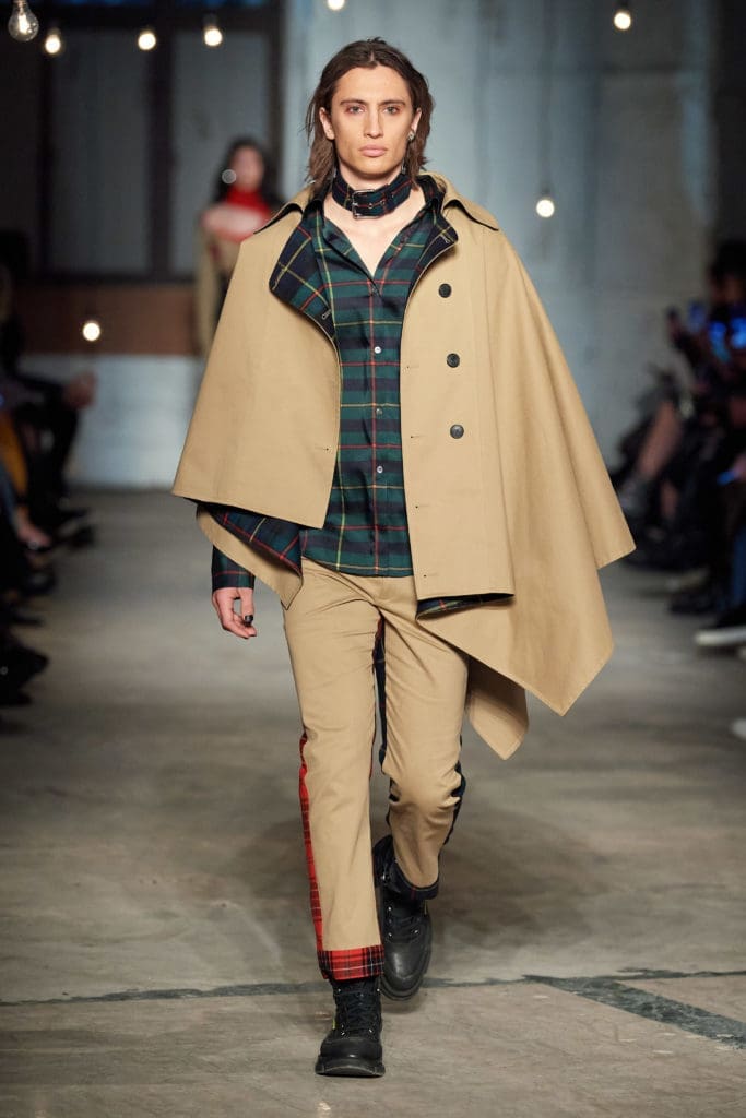 Monse trench cape, plaid scarf shirt, plaid half and half pant. (Photo by Imaxtree)