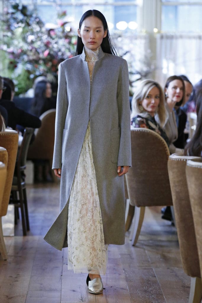 Adam Lippes ivory embroidered Chantilly lace turtleneck, ivory embroidered Chantilly lace gathered skirt, double face zibeline cashmere coat. (Photo by Dan Lecca)