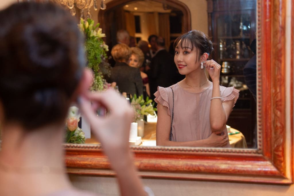 Houston Ballet Company Dancer Aoi Fujiwara tries on a pair of Tenenbaum Jewelers diamonds. (Photo by Wilson Parish)
