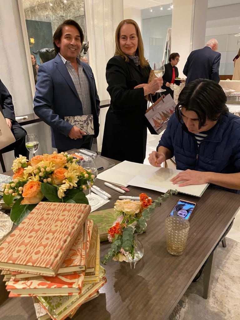 Caricature artist creates portraits in Fortuny gift books at the Donald Sutherland Showroom in the Decorative Center Houston.  (Photo by Shelby Hodge)