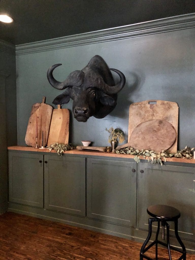 A black buffalo head hovers over a small private event space. (Photo by Megan Ziots)
