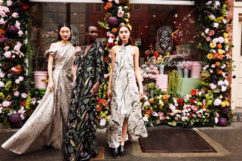 Lela Rose floral-themed evening wear, from left, metallic embossed matelassé side tucked gown, gold threaded fern georgette gown with turban sleeve, anthracite threaded fern threaded georgette twist-neck halter gown. (Photo by Taylor Jewell)